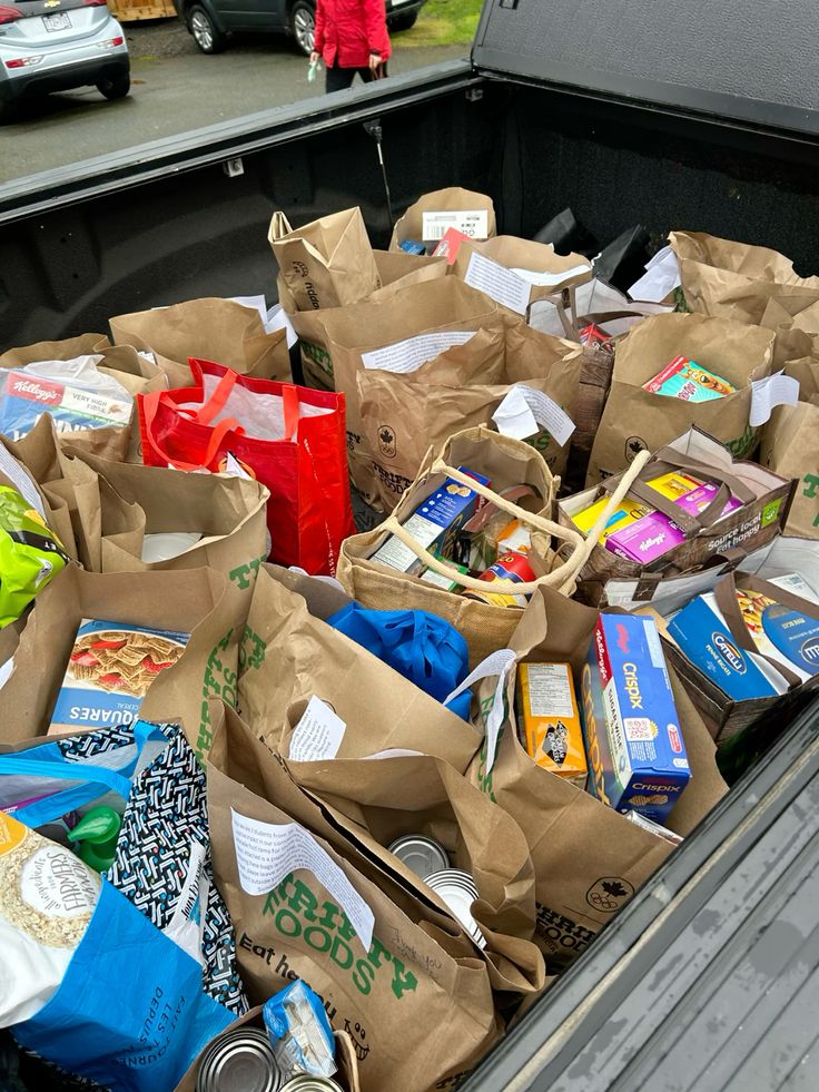 Donated food and supplies packed in bags for the community