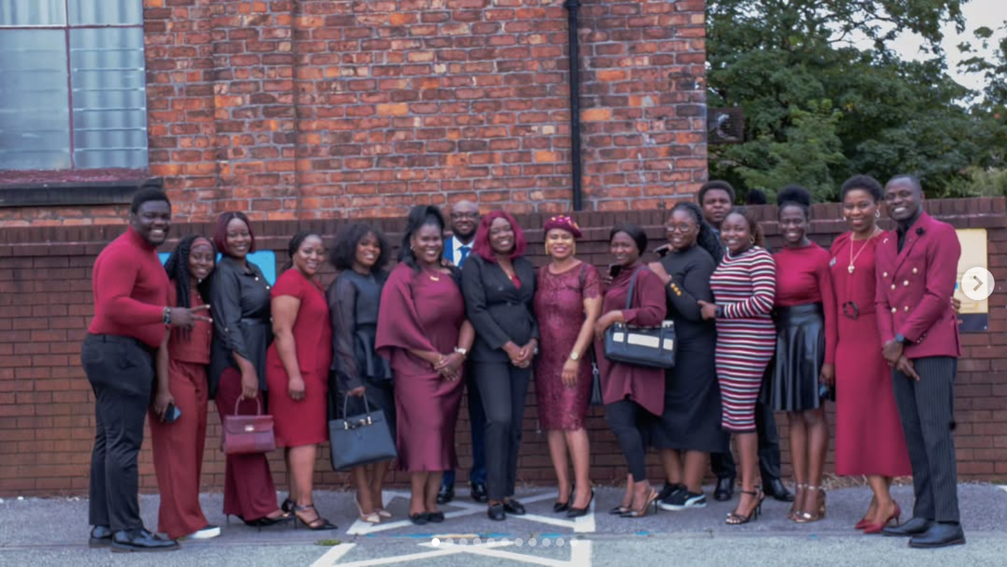 Women of the church standing together outside the building