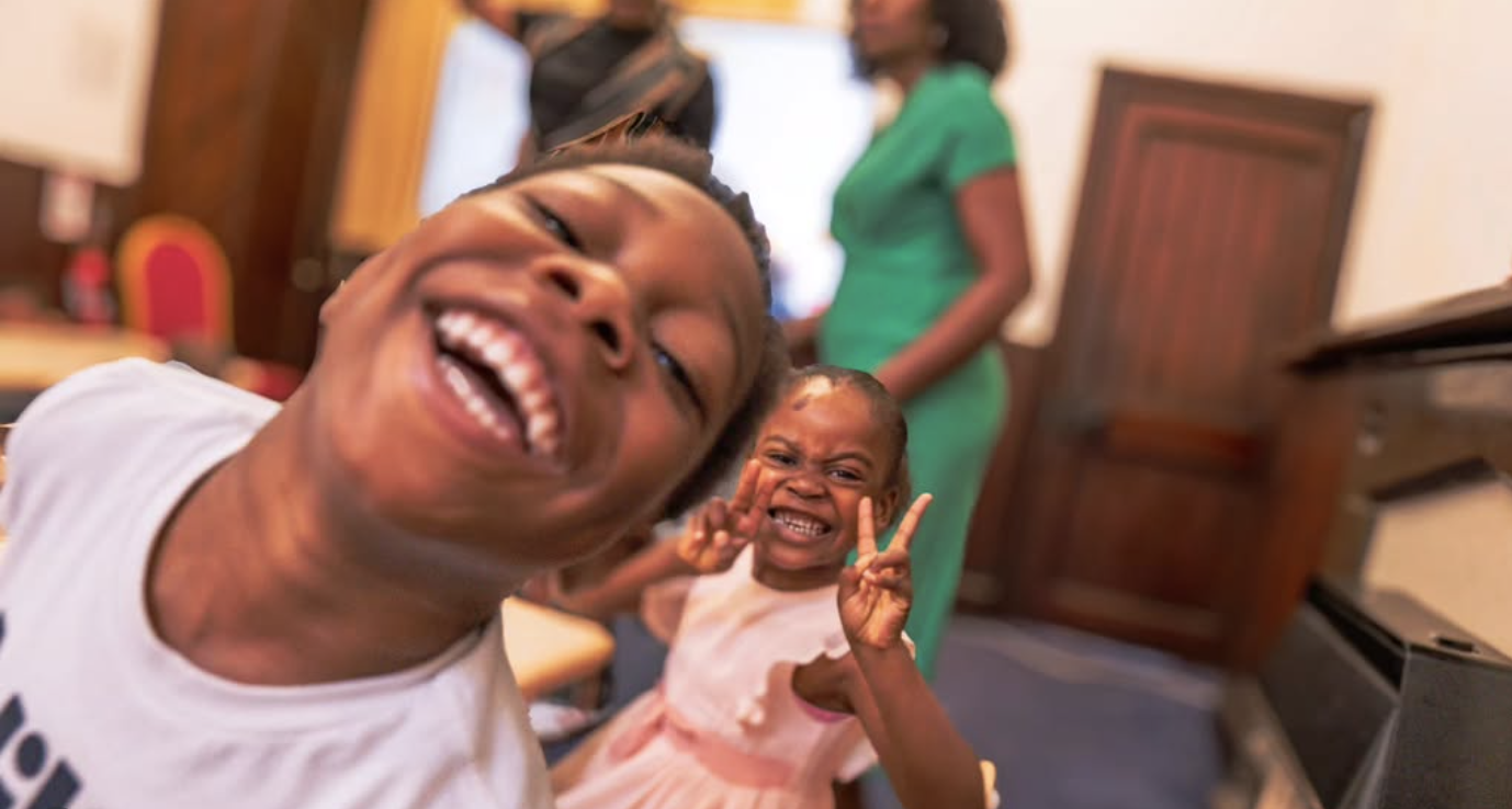Two smiling children at church